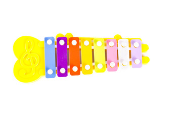 Colorful 8 tone toy xylophone (glockenspiel) made from metal and plastic on white background