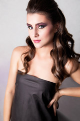 Naklejka premium beautiful girl with fashion make-up and hairstyle