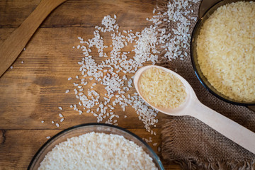 Rice. Steamed rice on wood background and burlap top view