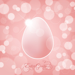 Easter greeting card with easter egg, hand lettering and pink bokeh background. Vector illustration.