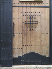Wooden door with studs