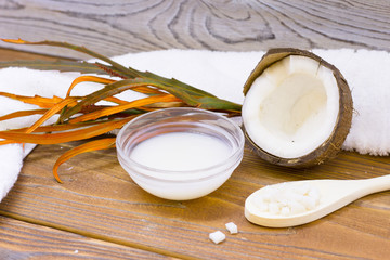 Natural herbal skin care products, top view ingredients coconut on table concept of the best all natural face moisturizer. Facial treatment preparation background