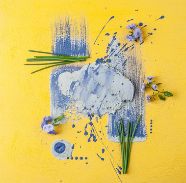 Flowers bell and shnits onions on a yellow-purple art background..