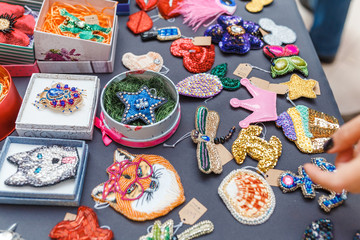 Handmade Brooch with beads on the showcase