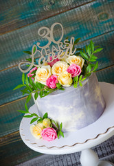 30th fnniversary cake with roses on cake stand