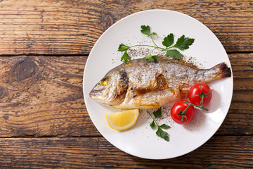 plate of baked fish with vegetables