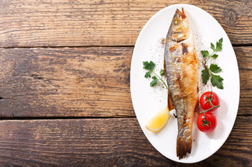 plate of baked fish with vegetables