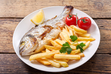 plate of baked fish with french fries