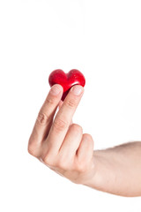 Male hand holding red heart, closeup on white background.