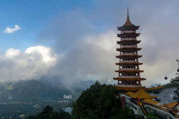The Chin Swee Caves Temple over clouds and heavy fog. The temple is situated in the most scenic site of Genting Highlands, Malaysia. Within the Temple is seated a statue of Qingshui, a Buddhist monk w