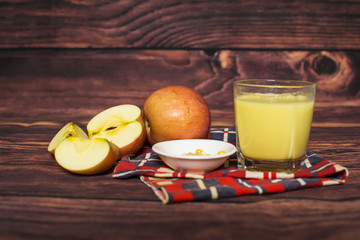 Fresh corn and milk on cobs on wooden table, closeup