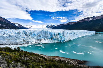 Naklejka na ściany i meble Tourists take in views of the Perito Moreno Glacier in Patagonia, Argentina