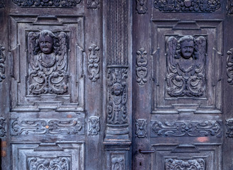 Medieval Gothic Church wooden door detail in Sibiu, Romania