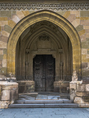 Medieval Gothic Church wooden door in Sibiu, Romania