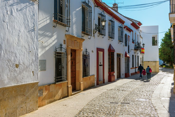 Fototapeta premium Strret with traditional Spanish old architecture in Ronda town, Spain