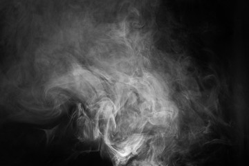 White smoke texture on a black background. Texture and abstract art