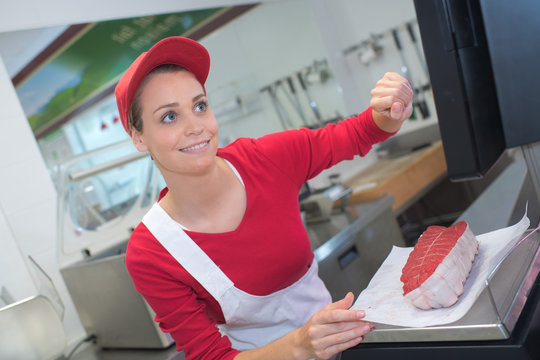 pretty butchery woman working in butchery shop
