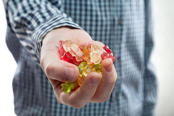 candy bears gelatine placer in the child's hand