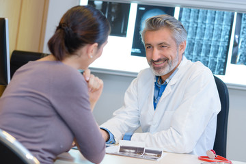 Smiling doctor with patient