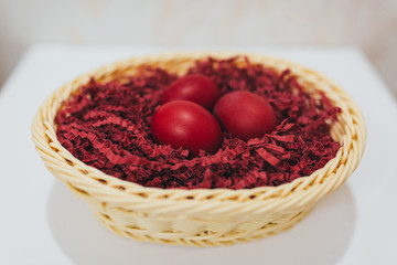 Close-up of pile of red Easter Eggs.
