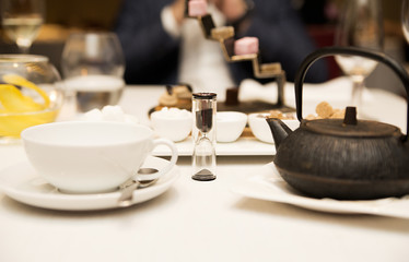 set for tea in the restaurant and hourglass