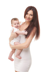 Portrait of mother and her cute baby in white. Happy family concept. Mother holding sweet baby isolated on white background