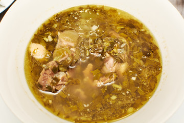 Chakapuli - Georgian stew.made from lamb,onions, tarragon leaves, cherry plums or tkemali