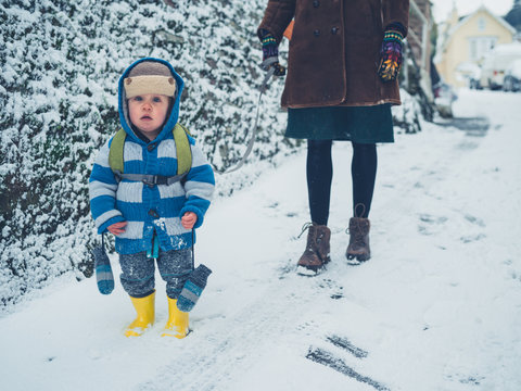 Toddler with his mother in the snow