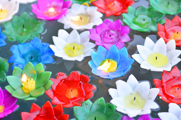 Colorful lotus flower made from candles.