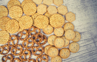 Mix of snacks : pretzels, crackers, cookies.