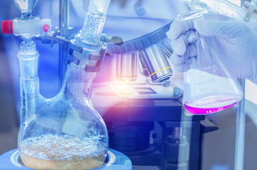 Distillation set with dropping funnels is separating the component substances from liquid mixture...