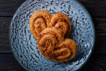 Puff buns on a blue plate.