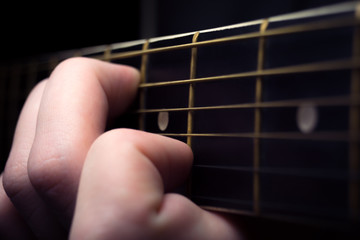 Close up of an guitar being