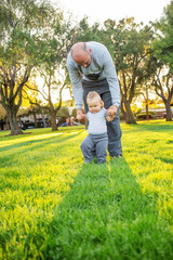 A father with baby son in park