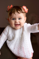 Amazing Ukrainian girl in a white sweater looking charming and laughing