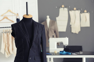 Tailor's mannequin with half-made jacket in atelier