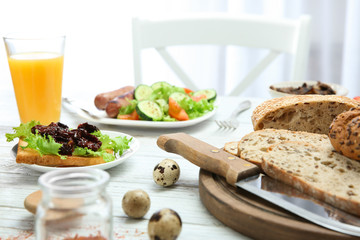 Delicious breakfast served on table