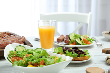 Delicious breakfast served on table