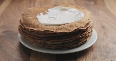 sour cream on top of pancakes or blini