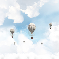 Flying hot air balloons in the air.