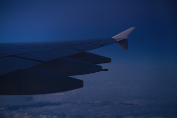 Fototapeta premium view of airplane wing during morning flight