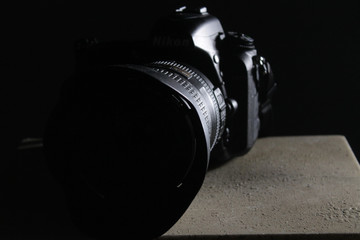 camera on grey stone