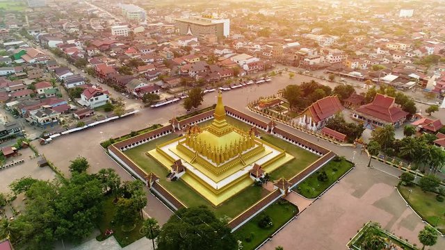  4k Video shot aerial view by drone of Wat Phra That Luang , Vientiane, Laos PDR. sunrise on Lao landmark temple.