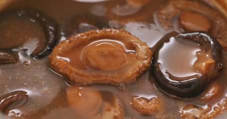 Chinese style cuisine, abalone and mushroom on lettuce