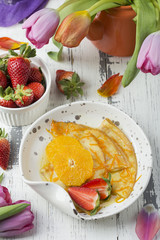 Crepe suzette, traditional french pancakes with orange syrup
