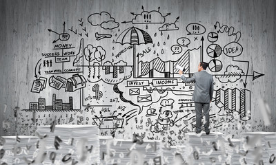 Businessman standing with megaphone.