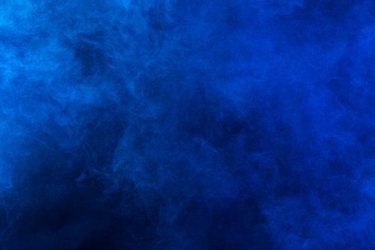 Blue smoke  texture on a black background. Texture and abstract art