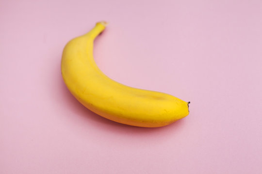 ripe banana on a pink background