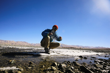 man with  backpack,  tourist,  brutal journey,  hike, the concept of active male recreation,  portrait of a severe, brutal man,  guy preparing equipment for the mountains