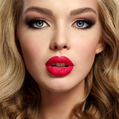 beautiful young blond girl with sexy red lips.